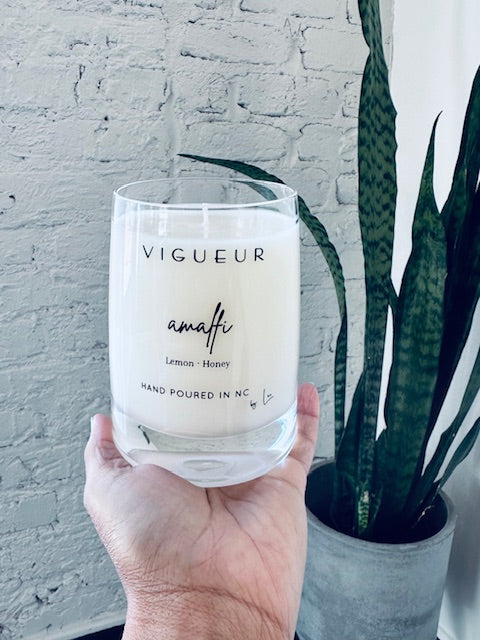 Vigueur Fragrances Amalfi soy candle with lemon, honey, and ctrus notes in a clear glass jar