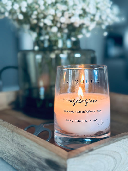 Vigueur Fragrances Ascension soy candle with Rosemary, Lemon Verbena, and Sage notes in a clear glass jar