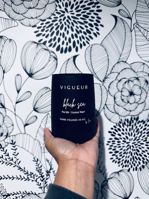 Vigueur Fragrances Black Sea soy candle with cotton blossom, musk and sea salt notes in a black glass jar
