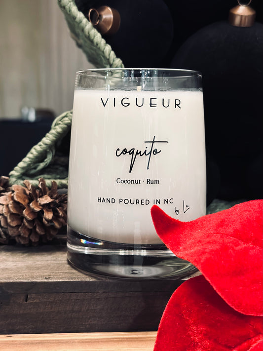 Vigueur Fragrances Coquito soy candle with coconut, cinnamon and rum notes in a clear glass jar