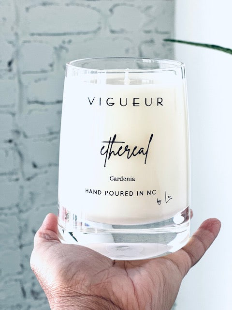 Vigueur Fragrances Ethereal soy candle with gardenia, musk and floral notes in a clear glass jar