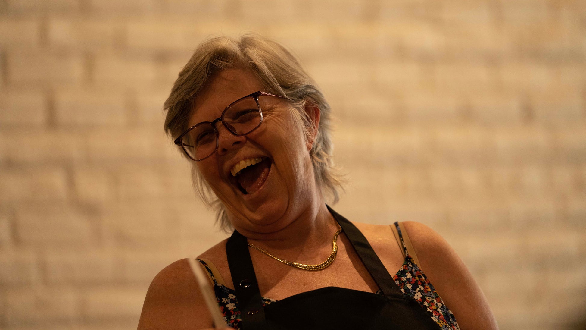 Woman laughing and having a great time at Candle Workshop
