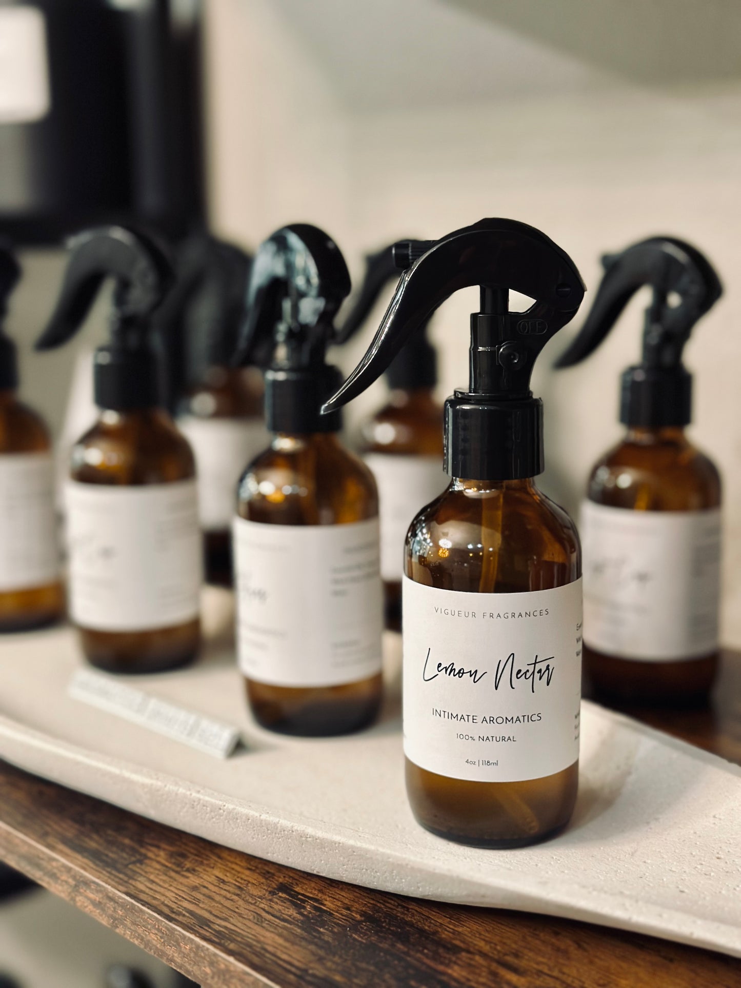 Luxury Intimate Aromatics linen sprays in glass bottles, infused with essential oils for home fragrance and cozy spaces.