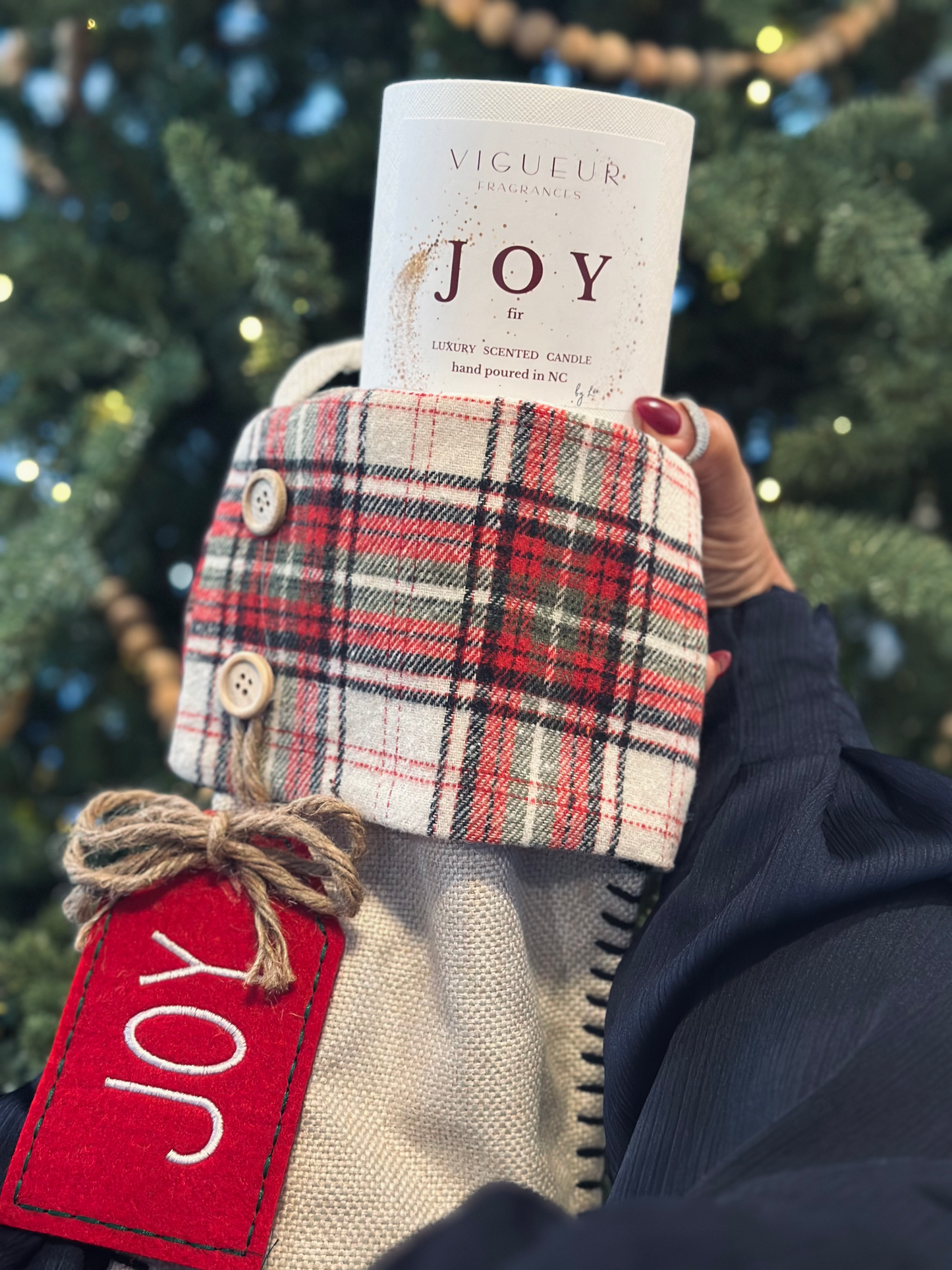 Vigueur Fragrances Joy soy candle with Fir, pine, and cedar notes in a white glass jar