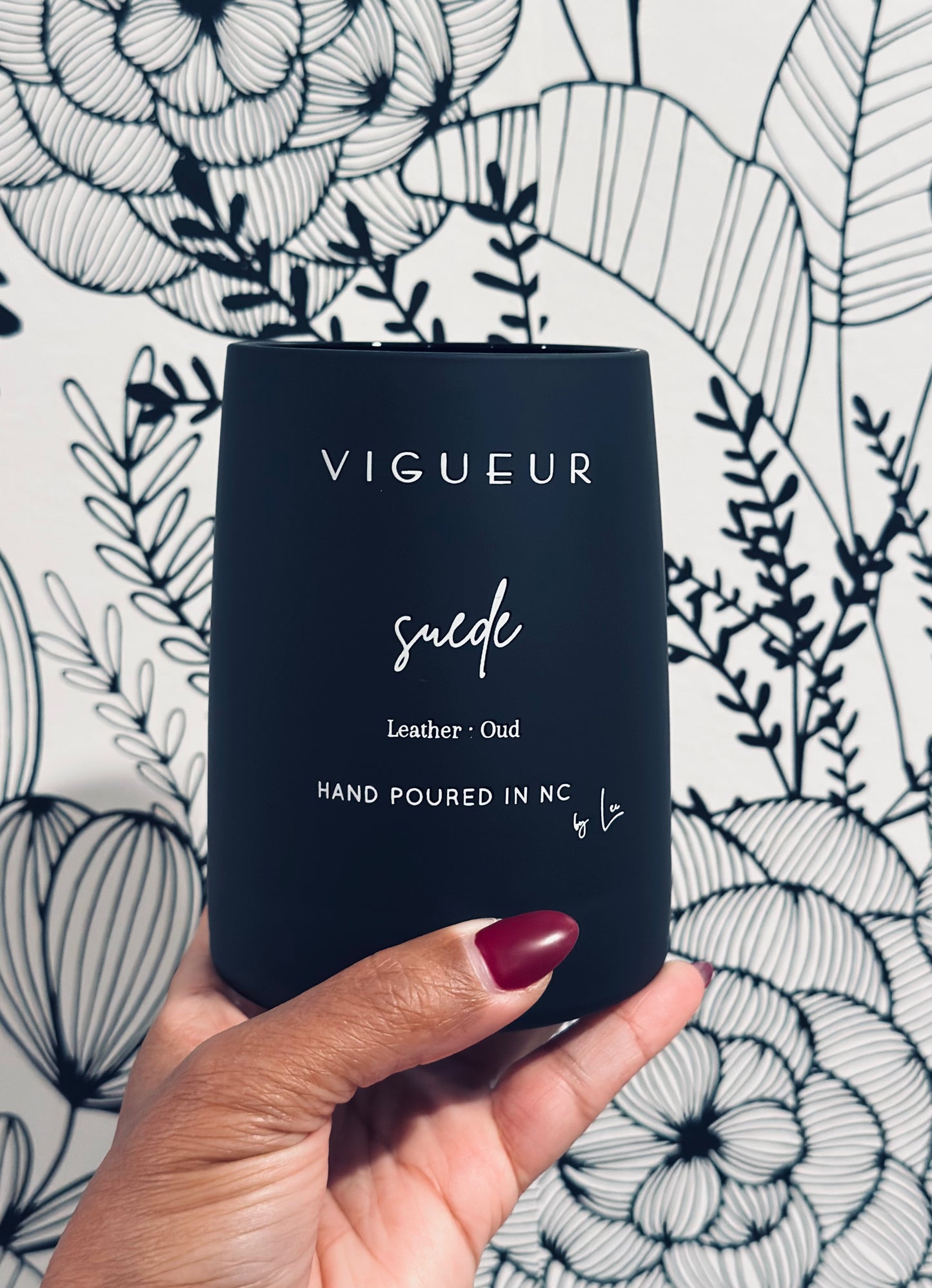 Vigueur Fragrances Suede soy candle with leather, oud, and woody notes in a black glass jar