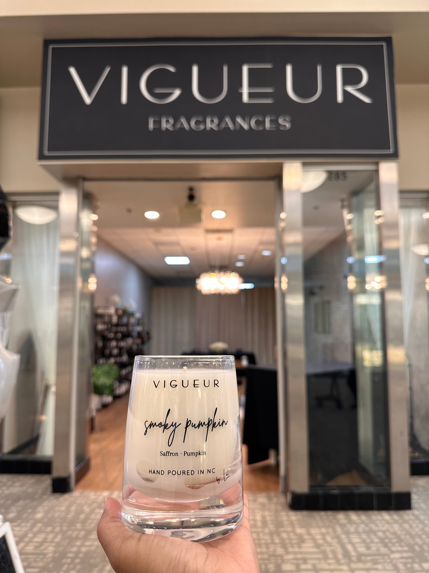 Vigueur Fragrances Smoky Pumpkin soy candle with saffron, pumpkin and woody/gourmand notes in a clear glass jar